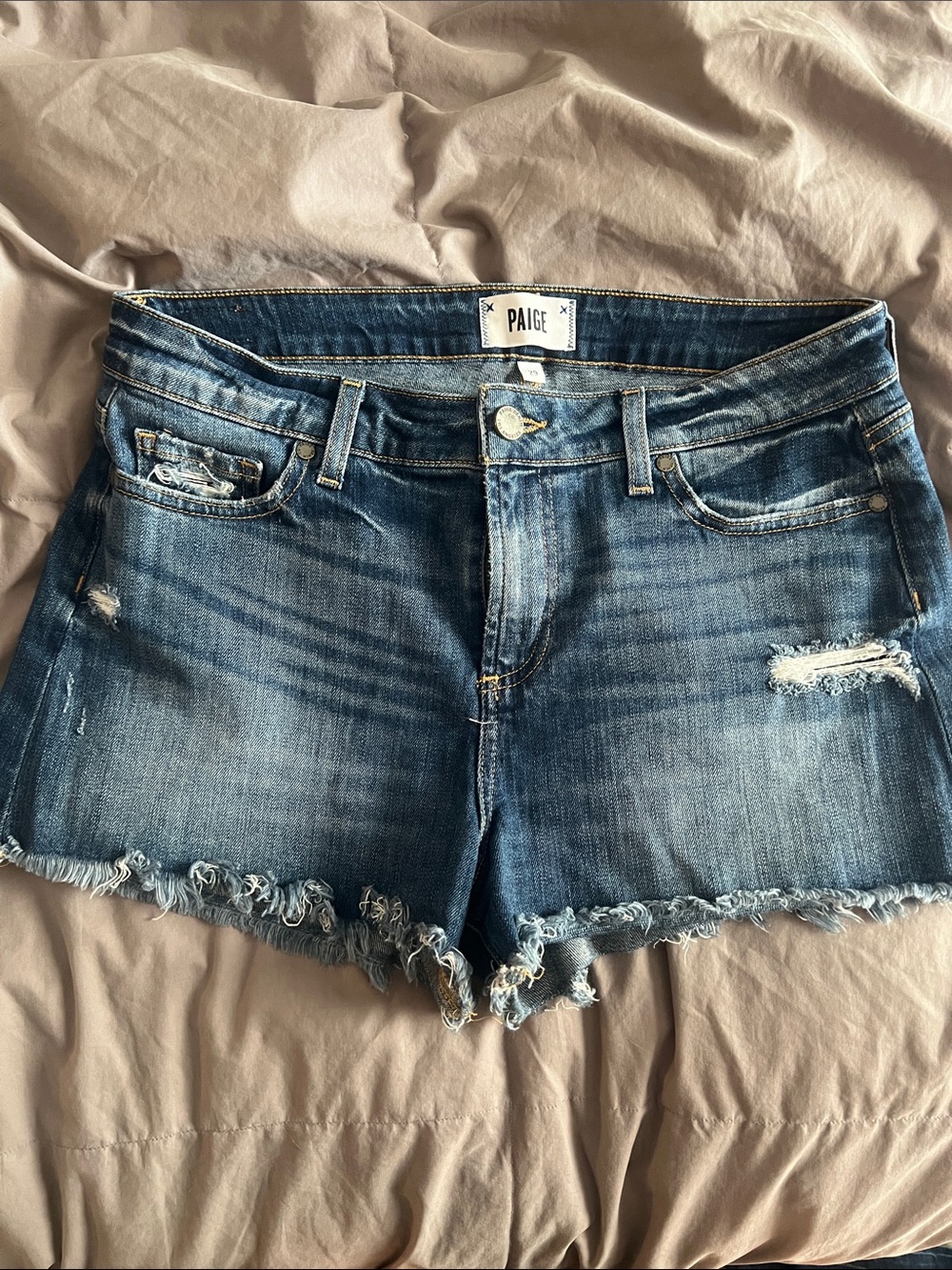 PAIGE Distressed Denim Cutoff Shorts in Blue Wash
